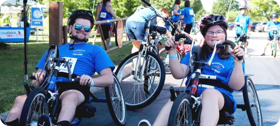 A man and a woman riding bikes