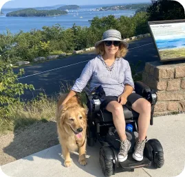 A woman posing with her dog