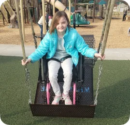 A young girl on a swing