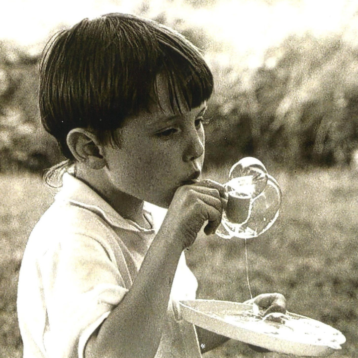 A child blowing a bubble