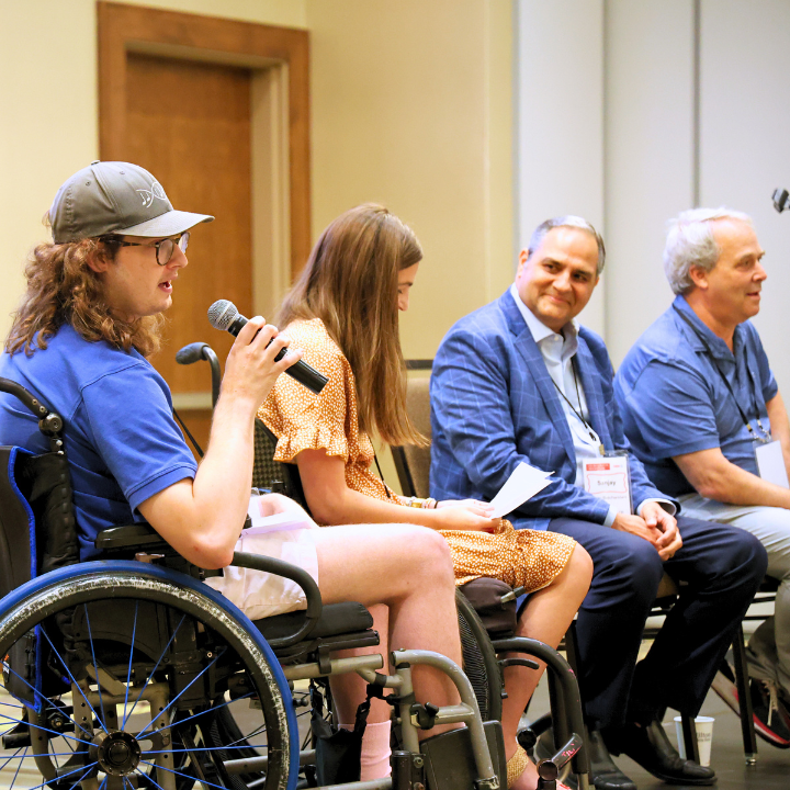 image of 4 people taking part in event speaking