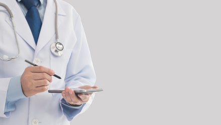 medical professional with tablet and stethoscope