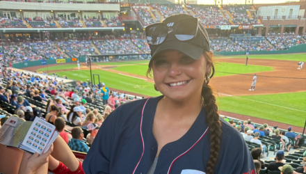 Photo of Mekayla Holm at a baseball game