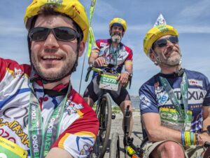 Alex Fielding riding trike with rideATAXIA teammates